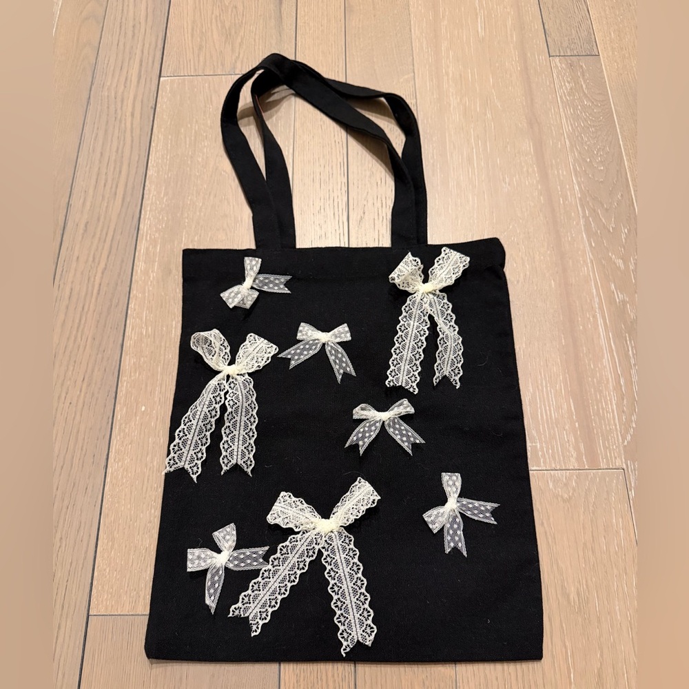 petit moments lace bow tote bag